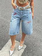 Dam knälånga vida shorts med broderi